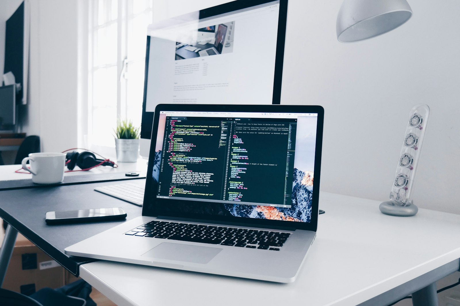 Designers and developers reviewing mobile screens